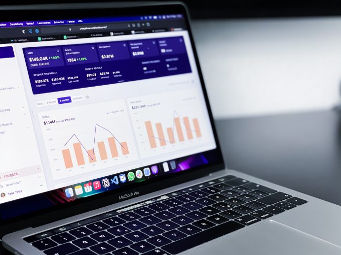 Image of a laptop with operational metrics, showing business processes being completed
