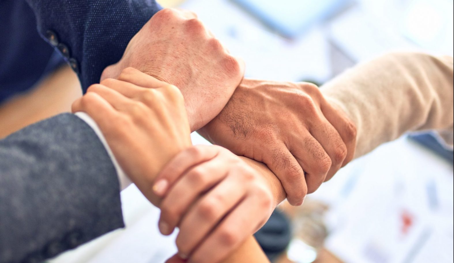 Team linking hands together