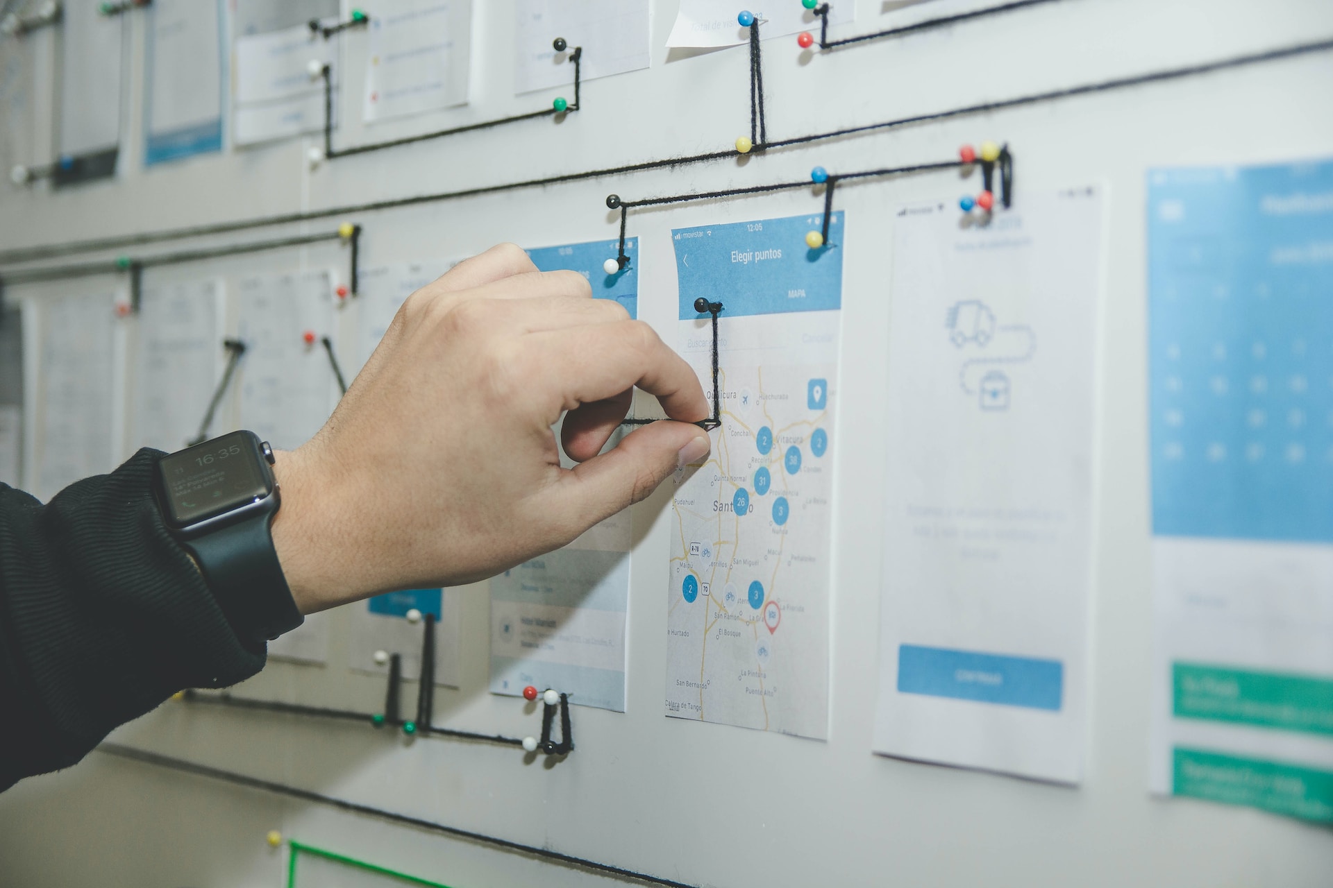 Person working with visuals on a whiteboard