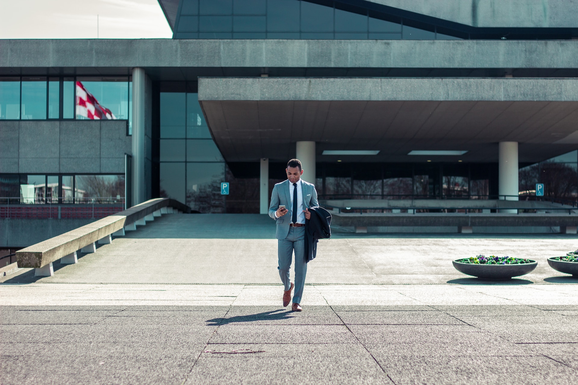 Man in suit walking out of work