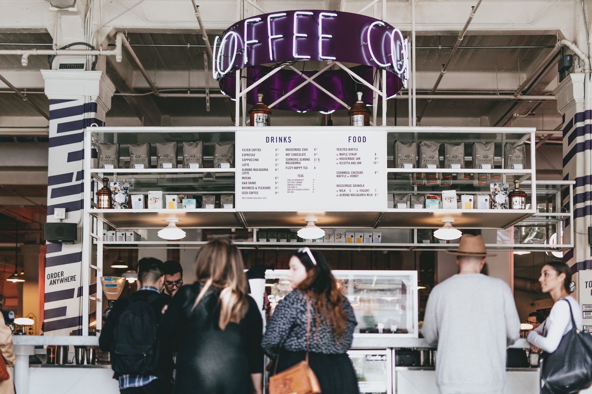 Customers standing at a coffee shop