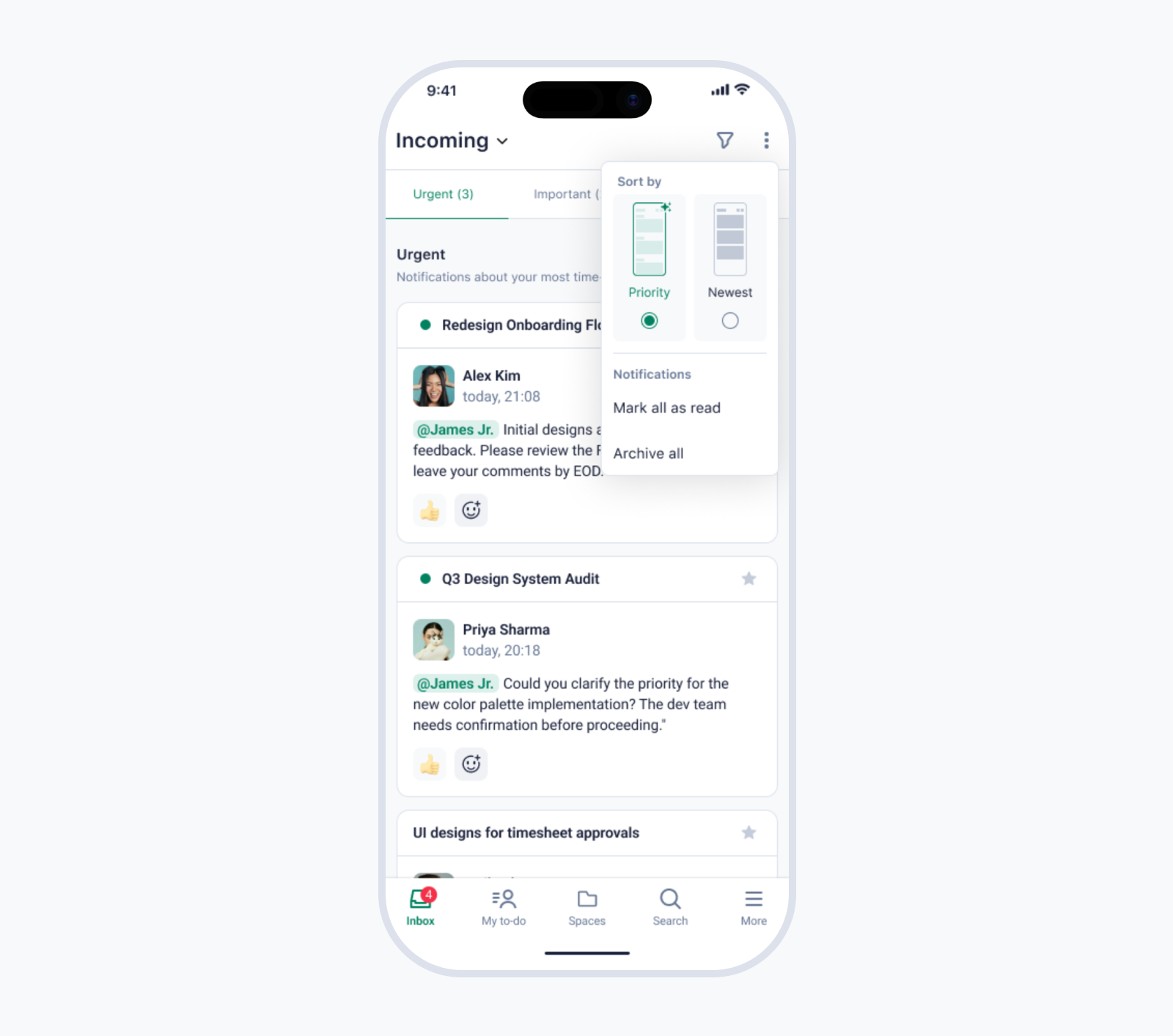 A person working on a laptop with a planner and coffee cup on the table.