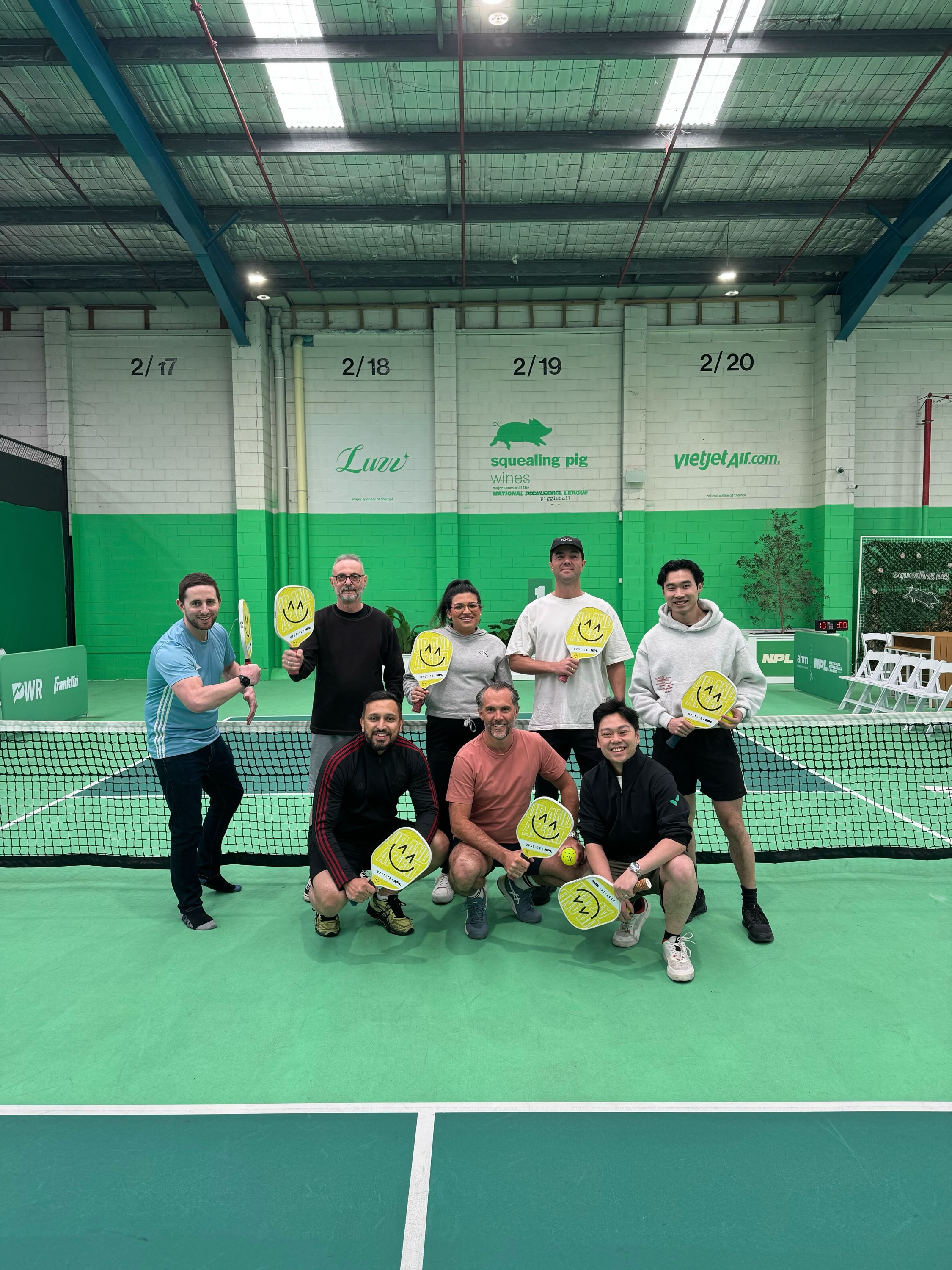 Patrick Lalanne in squash court with Wrike team