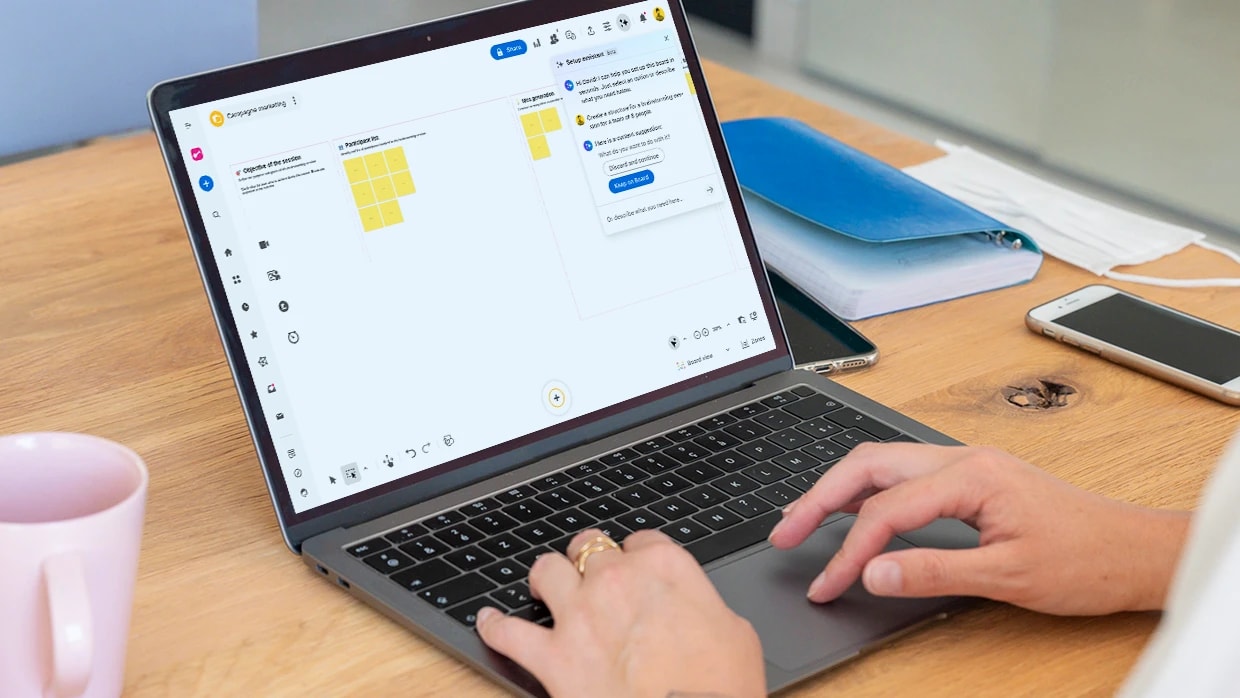 Klaxoon ideation board with AI assistant prompts and color-coded sticky notes.