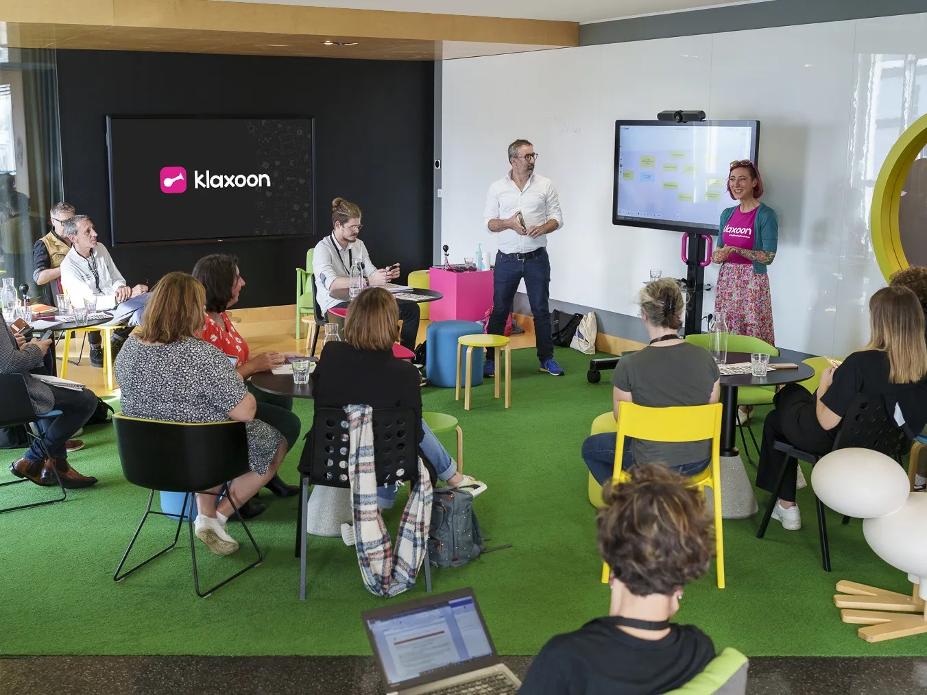 Professional services project dashboard displayed on laptop and desktop screens.