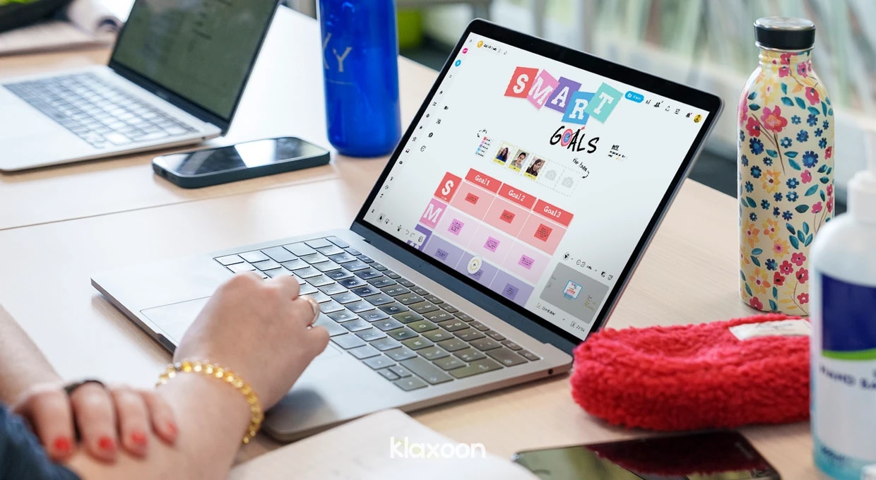 A person working on a computer displaying a SMART Goals template completed while setting up a training course. | Klaxoon