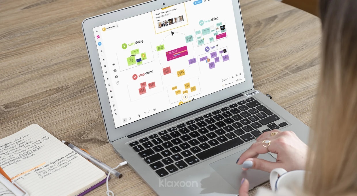 A person working on a computer that displays a Retrospective Board, where all important ideas are centralized and visually classified. | Klaxoon