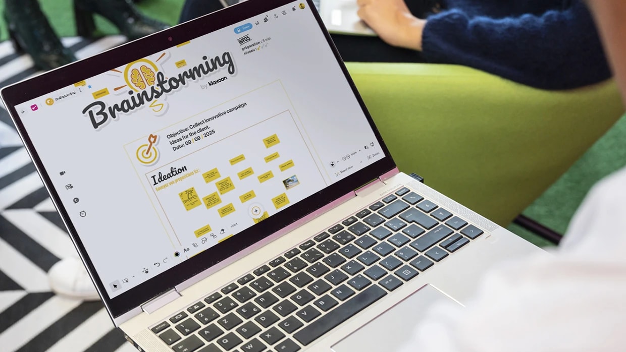 Co-creation brainstorming board with color-coded sticky notes.