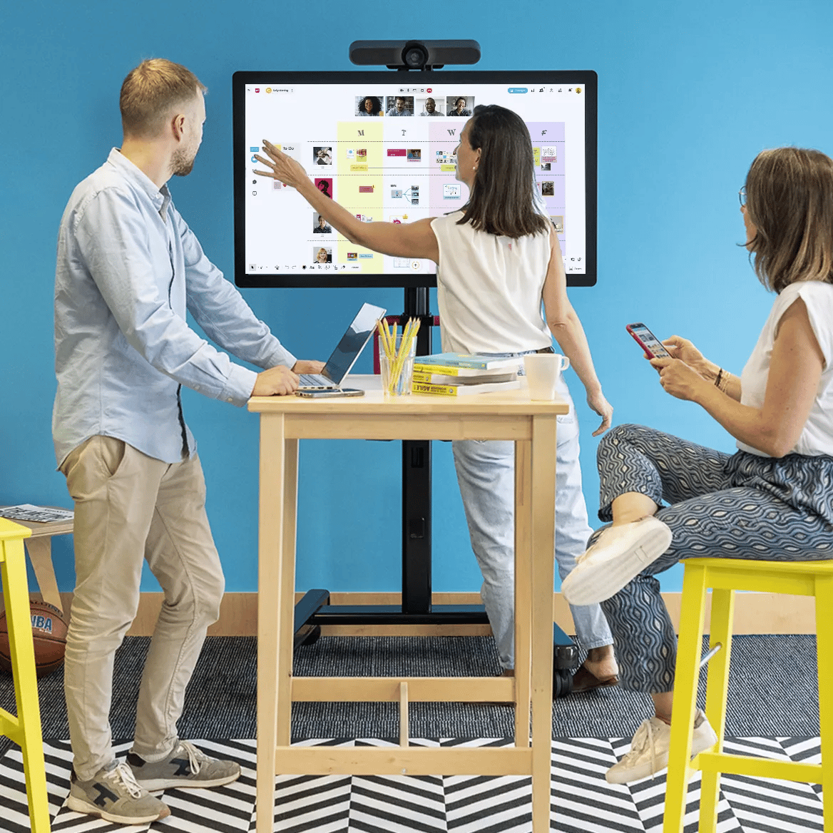 Mobile dashboard displaying professional services tasks next to two collaborating team members.
