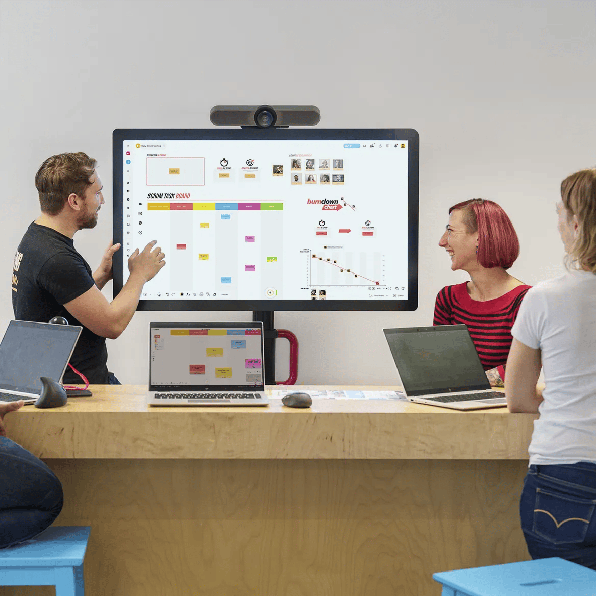 Professional services team collaborating on project analytics dashboards.