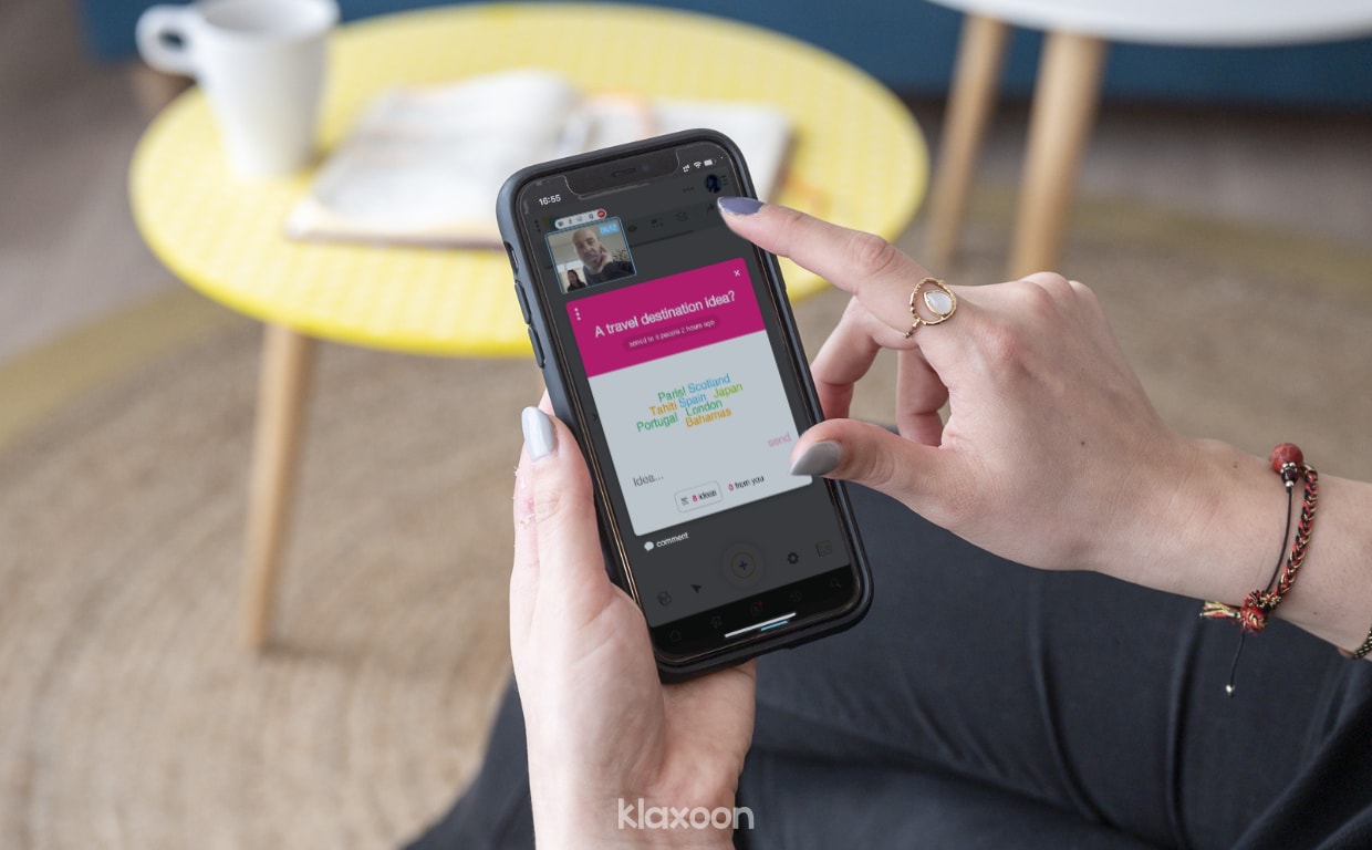 A person doing an icebreaker on mobile, with a word cloud question asking about ideas of travel destinations. | Klaxoon