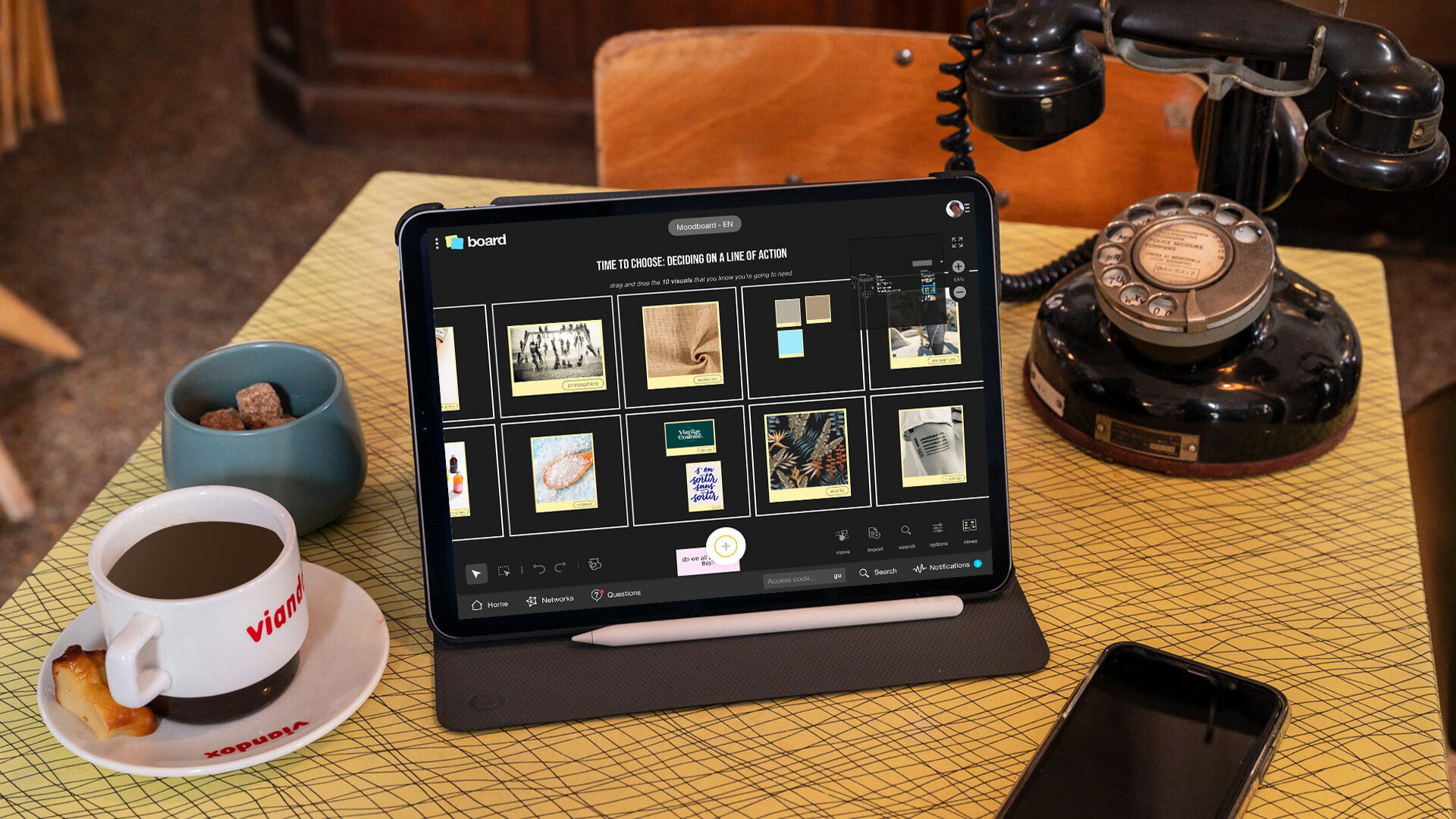 A tablet on a table showing the Moodboard template. | Klaxoon