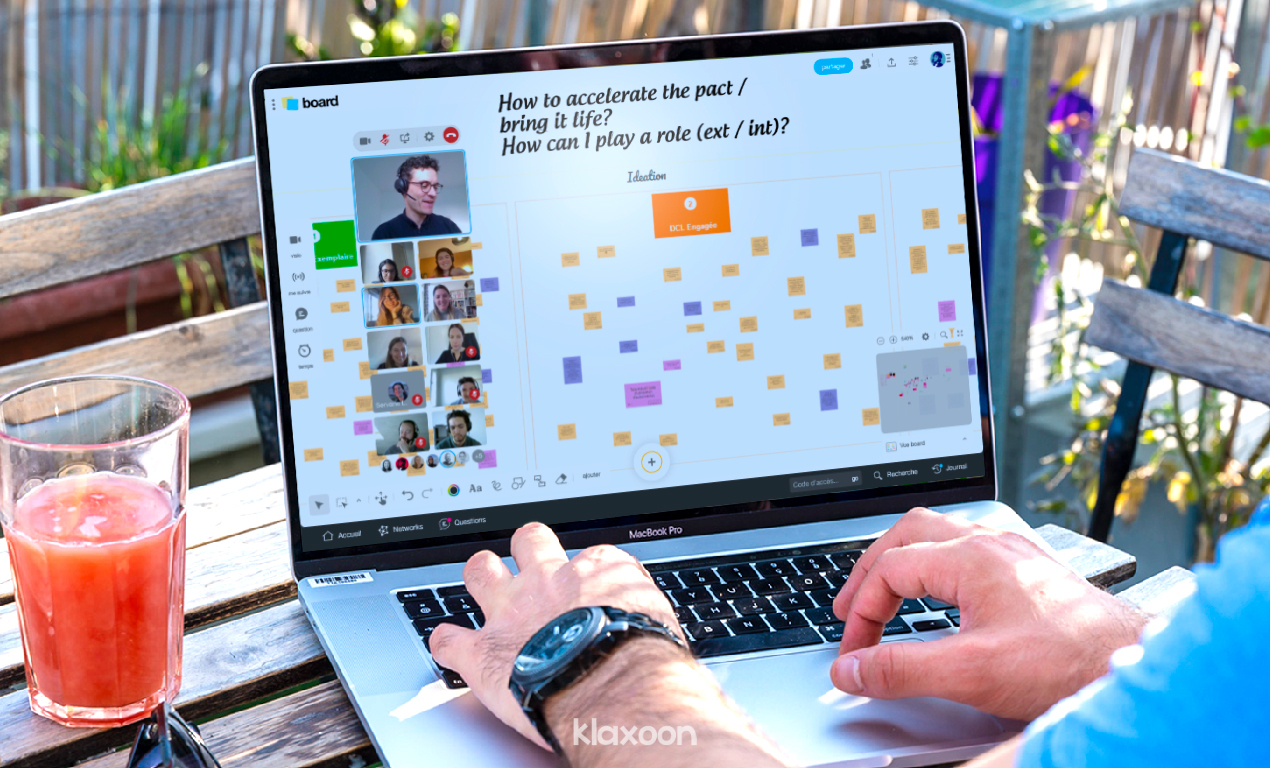 A Board open remotely on desktop, with a large group of people adding and discussing ideas. | Klaxoon