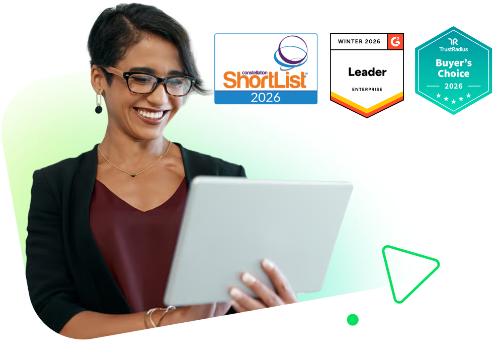 Business professionals collaborating at a conference table with enterprise solution badges displayed.