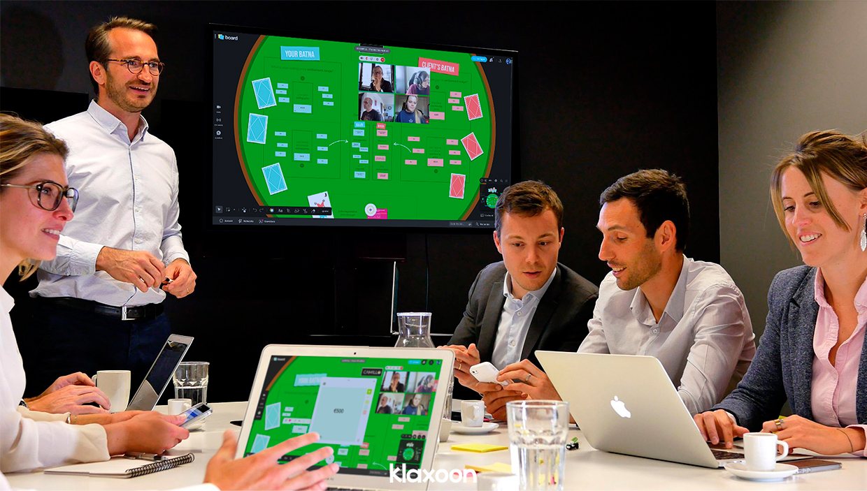 A small group of salespeople is discussing the BATNA template displayed on their screens. | Klaxoon