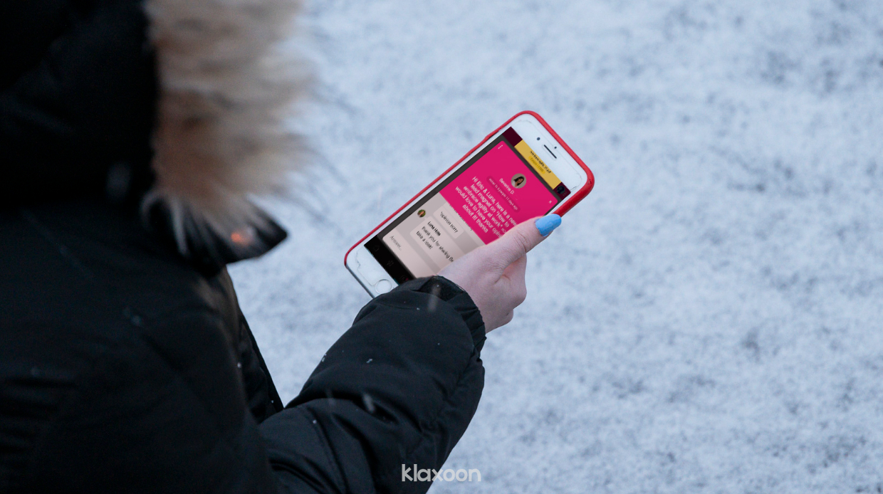 A phone screen shows a series of Questions. | Klaxoon