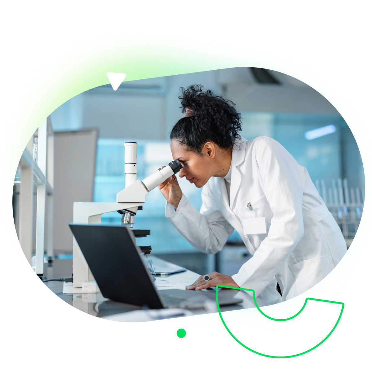 Life science researchers collaborating in lab with Wrike project management dashboard.