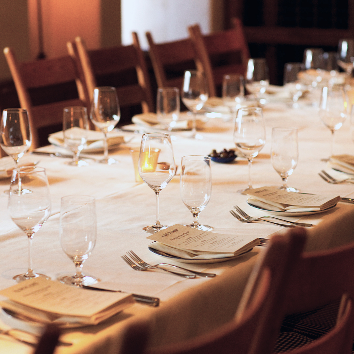 Exterior of Kokkari Estiatorio restaurant with Mediterranean architecture and entrance.