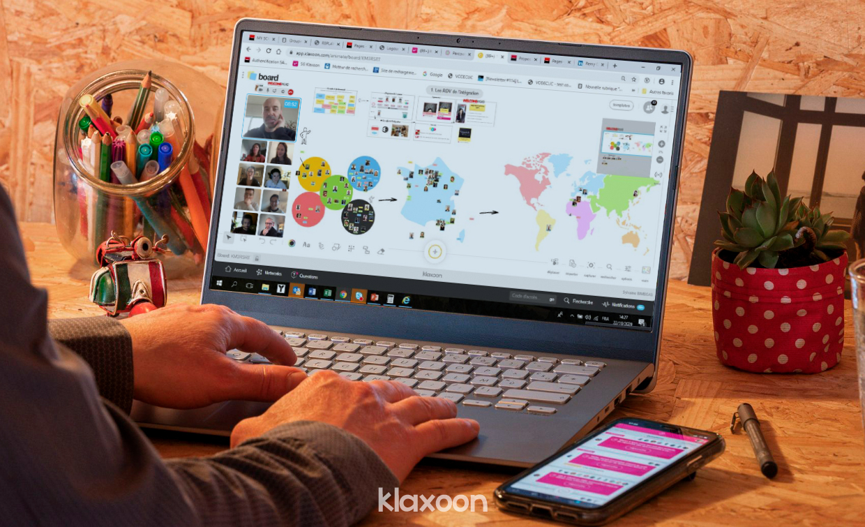A group of about ten people discussing remotely on a virtual Board with maps of France and the world. | Klaxoon